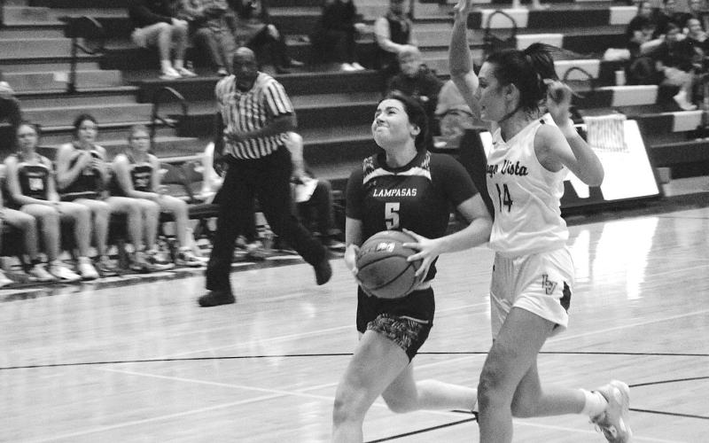 Brooke White moves in for a fast-break layup. That accounted for two of her 11 points in the game Friday. HUNTER KING | DISPATCH RECORD