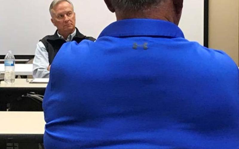County Judge Randy Hoyer, background, discusses subdivision regulations with county commissioners and development representatives at the Lampasas County Office Building conference room. MONIQUE BRAND | DISPATCH RECORD