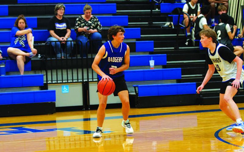 Ty Borchardt dribbles out on the perimeter during a spring league basketball game. HUNTER KING | DISPATCH RECORD