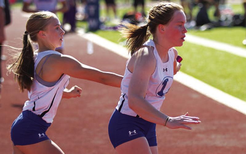 Aimee Weinheimer, left, and Lola Patterson ran in the 4x400-meter relay at the regional tournament. FILE PHOTO