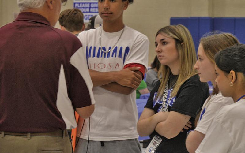 ERICK MITCHELL | DISPATCH RECORD Lampasas High School students learn more about aviation opportunities at Tuesday’s job fair.