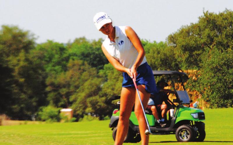 The senior golfer hits a putt on the ninth hole during her second round in the state tournament. HUNTER KING | DISPATCH RECORD