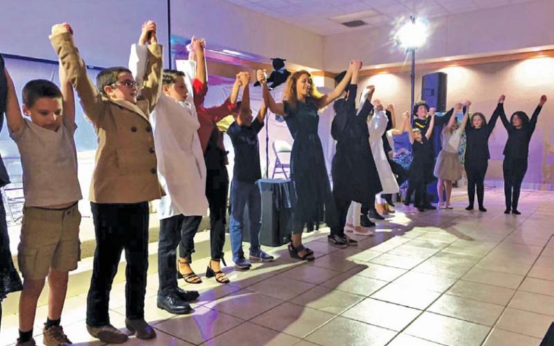 Students presented an original play, “Light of the World,” written by teacher Juliana Dwamena, as part of the entertainment at Providence Christian Academy’s annual banquet. julie williams | courtesy photo
