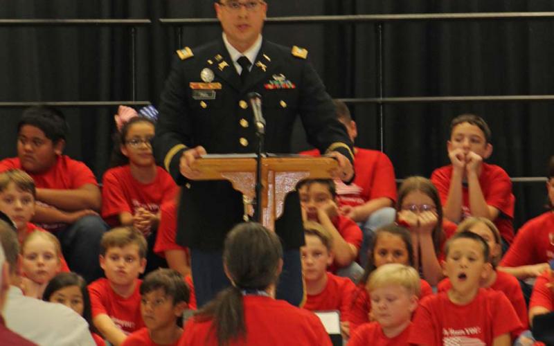 Capt. Eric Paul addresses the students, faculty and guests present at the “Salute to America’s Soldiers” program offered by Taylor Creek Elementary School fourth-graders. Joycesarah McCabe | Dispatch Record