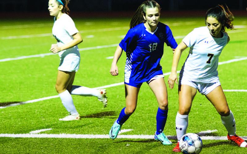 Lyndsie Perez challenges a Stephenville player for the ball during last Friday’s match. HUNTER KING | DISPATCH RECORD