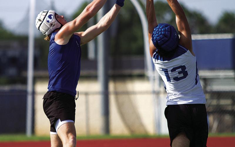 Kayden VanPelt makes a touchdown catch over the hands of a Cougar defensive back. HUNTER KING | DISPATCH RECORD
