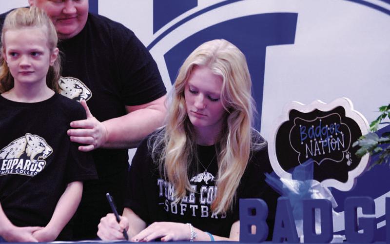 Kali Hunter signs her letter of intent to play softball for Temple College. HUNTER KING | DISPATCH RECORD