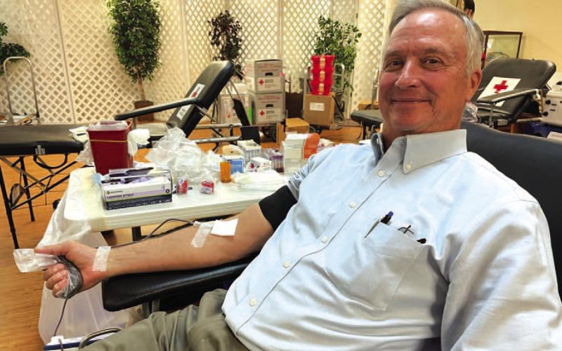 County Judge Randy Hoyer makes a donation of blood at last week’s drive. With his contribution, Hoyer has reached the one-gallon level as a donor. COURTESY PHOTO