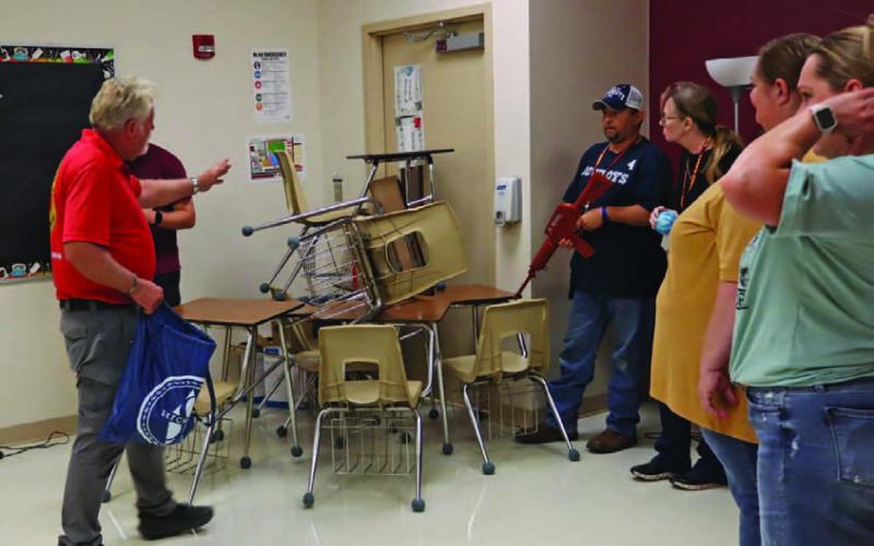 Johnny Price of Big Iron Handgun License Training in Waco directs Lometa teachers in a school safety training during inservice before the start of the new term. CHERI JAY-WIENECKE | DISPATCH RECORD