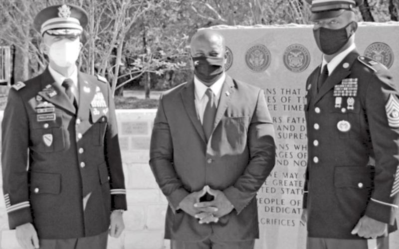 Lt. Col. Robert Phillipson, left, Kempner Mayor Dr. Keith Harvey, center, and Command Sgt. Maj. Charles Chapelle stand at the veterans’ monument at Sylvia Tucker Memorial Park. JEFF LOWE | DISPATCH RECORD