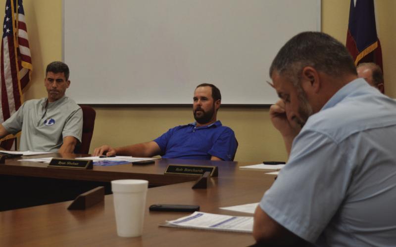 Superintendent Dr. Chane Rascoe, at left, is shown with trustees Ryan Shahan and Jeff Rutland as they consider what facilities improvements make the most sense to include in a bond proposal. ERICK MITCHELL | DISPATCH RECORD