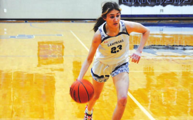 Payton Tatum dribbles past a Gatesville defender on her way to the basket. She scored 22 points in the game Tuesday at home. HUNTER KING | DISPATCH RECORD