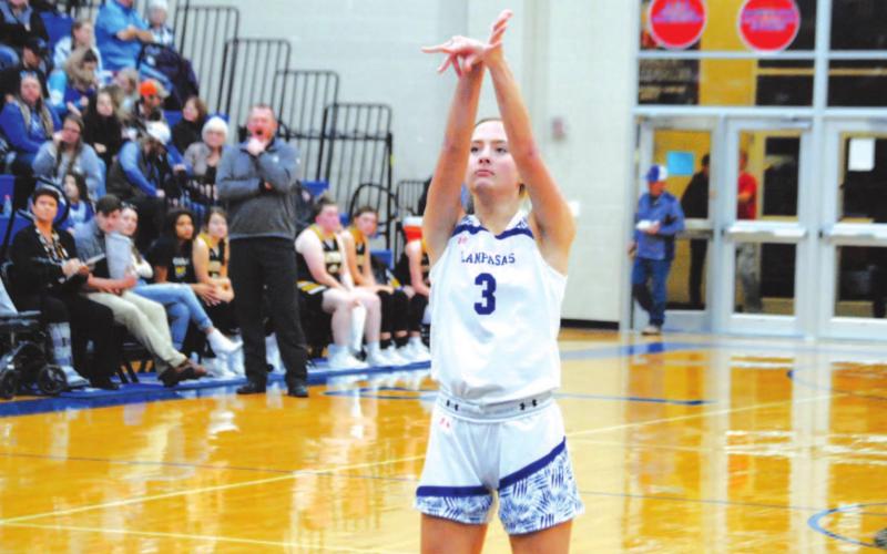 Jenna Ball follows through on a free throw after completing an and-one on a three-point basket for the Lady Badgers on Tuesday. HUNTER KING | DISPATCH RECORD