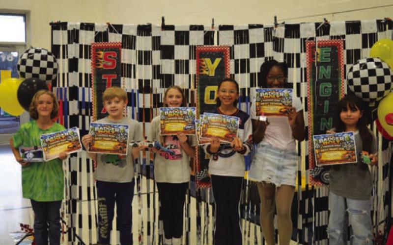 From left, Willow Gardner (best design), Morgan Oliver (best paint job), Saylor Whitley (best school spirit), Jordyn Burnett (staff’s choice), Christian James (best design) and Jazlyn Zapata (best paint job) were honored for their entries. ERICK MITCHELL | DISPATCH RECORD