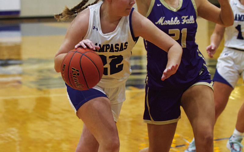 Kennedi Smart dribbles past a Lady Mustang defender in last Friday’s contest. HUNTER KING | DISPATCH RECORD