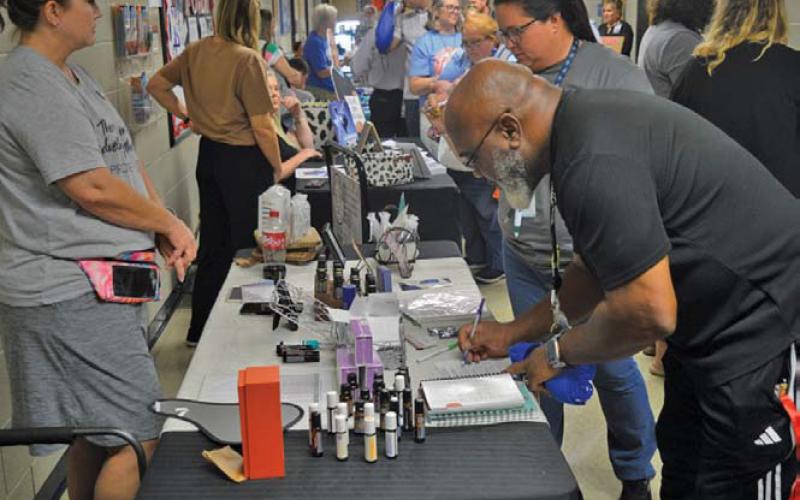 LISD employees make their way through the hallways to learn more about local businesses during the Back to School Bash event on Friday. erick mitchell | dispatch record