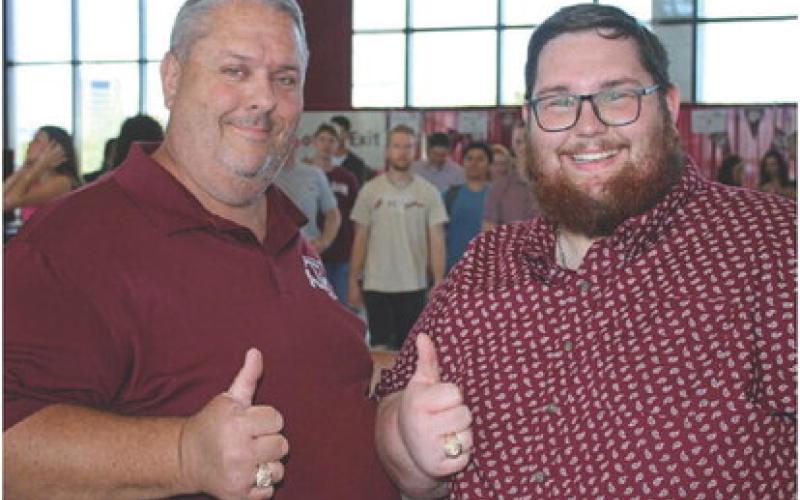 MASON HINES | DISPATCH RECORD John Hines, left, and Mason Hines both received their Aggie rings on April 13.