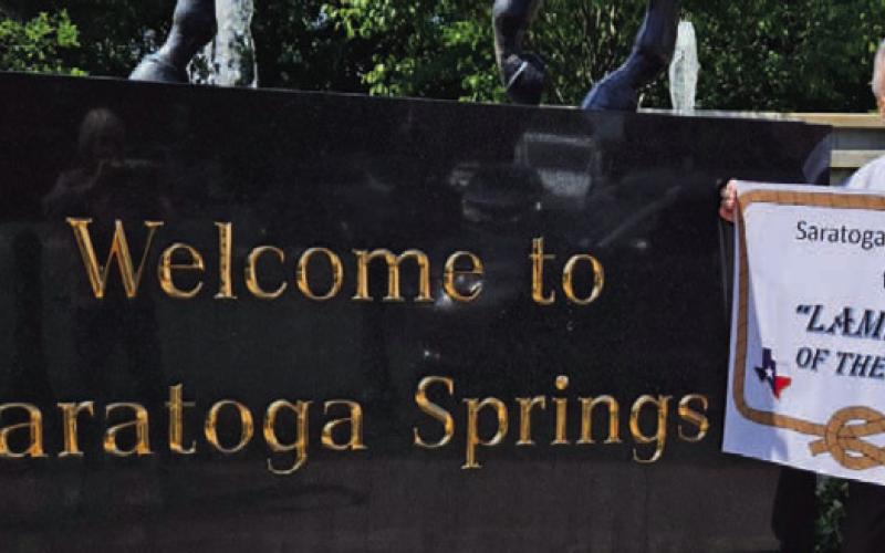 Former Lampasan Phil King is pictured on a recent visit to Saratoga Springs, New York, where he displayed his banner proclaiming it the “Lampasas of the North.” COURTESY PHOTO