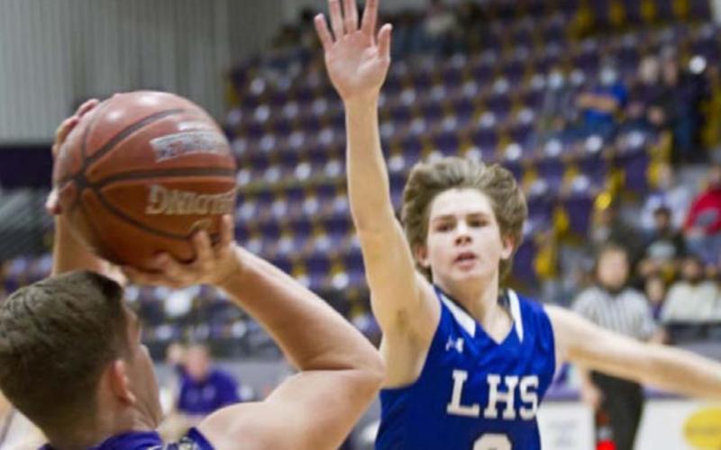 Nate Borchardt, right, plays defense in a non-district victory. FILE PHOTO