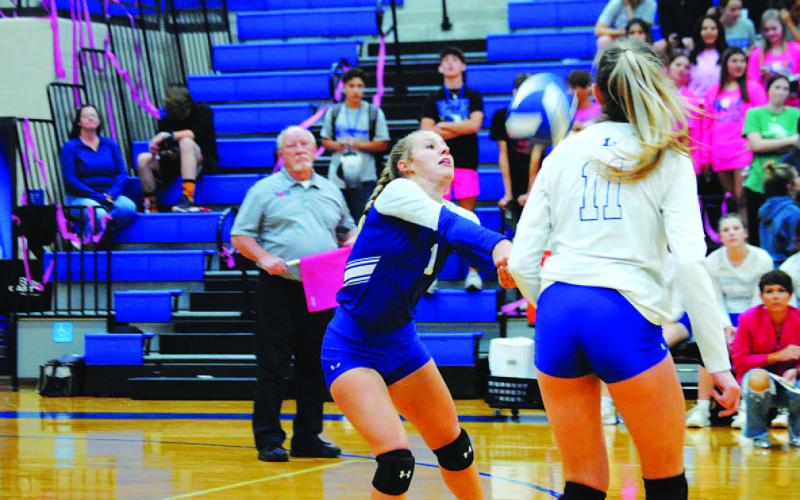 Bre Quarles reaches for a ball during the Pink Out game against Jarrell on Tuesday. HUNTER KING | DISPATCH RECORD