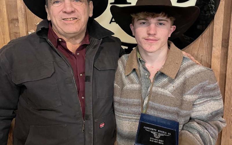 Noah Lee, right, won the 2025 Bullothon and shows off his buckle with Mike Seiler of Bullothon Promotions. COURTESY PHOTO