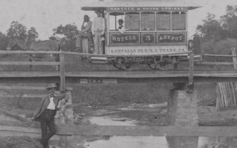 William &amp;amp; Weatherington Encampment Photo 1885. Lettering on the side of the car: Hancock &amp;amp; Hanna Springs; Hotels &amp;amp; Depot; Lampasas St. R.W. &amp;amp; Trans. Co STEREOSCOPIC PICTURE SOURCES: SMU LIBRARIES DIGITAL COLLECTION. COURTESY DEGOLYER LIBRARY, SOUTHERN METHODIST UNIVERSITY, LAWRENCE T. JONES III TEXAS PHOTOGRAPHY COLLECTION.