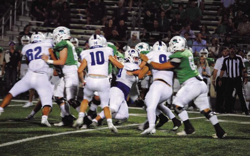 HUNTER KING | DISPATCH RECORD Landon Stegall stuffs a run up the middle Friday night.