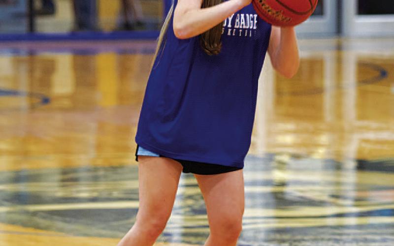 HUNTER KING | DISPATCH RECORD Addison Borchardt shoots a three during summer league.