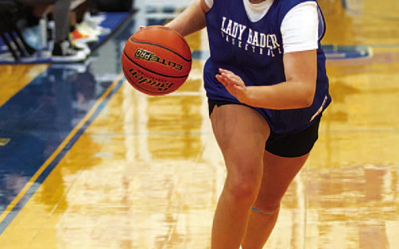 HUNTER KING | DISPATCH RECORD Kennedi Smart dribbles down the wing.