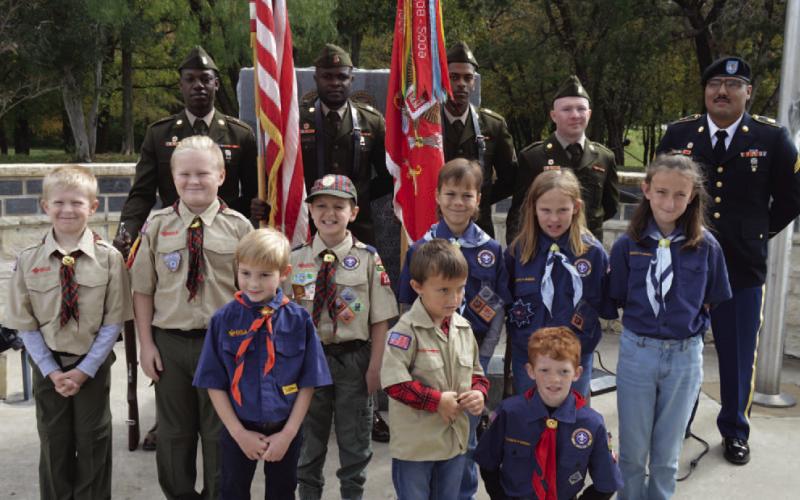 ERICK MITCHELL | DISPATCH RECORD Cub Scout Pack 100 led the audience in reciting the pledge of allegiance, while the 62nd Engineer Battalion -- the city of Kempner’s partner battalion from Fort Cavazos -- presented the colors to open the Nov. 11 Veterans Day ceremony at Sylvia Tucker Memorial Park.
