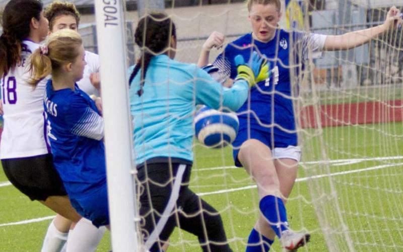 Becca Nobles (11) scores the Lady Badgers’ third goal in their season finale, a 3-0 win over Florence. JEFF LOWE | DISPATCH RECORD