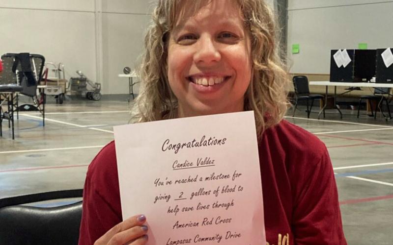 Candice Valdez received a certificate marking her two-gallon donation milestone. COURTESY PHOTO