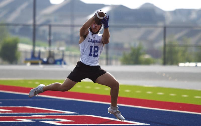 HUNTER KING | DISPATCH RECORD KJ Reed receives a ball in the end zone earlier this week.