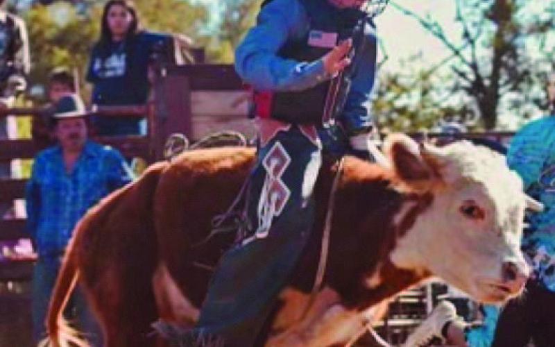 COURTESY PHOTO Bull rider Ryder Winkler rides a bull during a similar Bull Bash event.