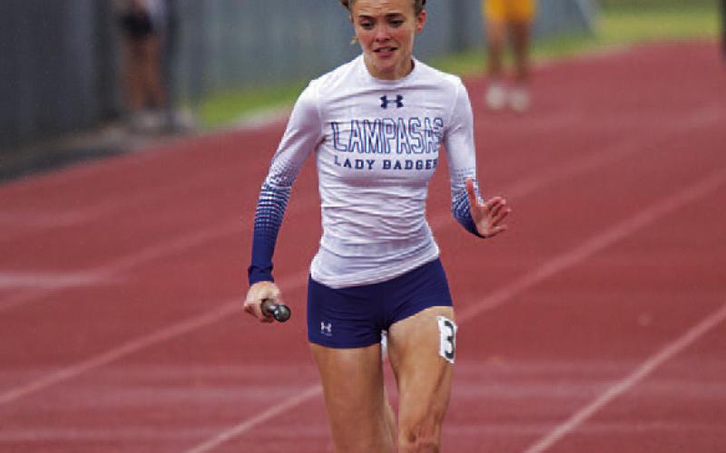 Hailey Palmer pushes to the end of her race at the home meet. HUNTER KING | DISPATCH RECORD