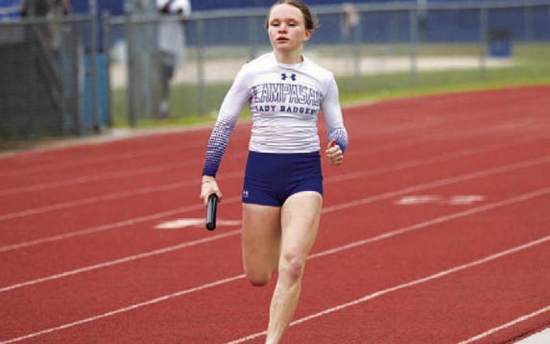 Lola Patterson runs a leg of the girls’ 4x200-meter relay. HUNTER KING | DISPATCH RECORD