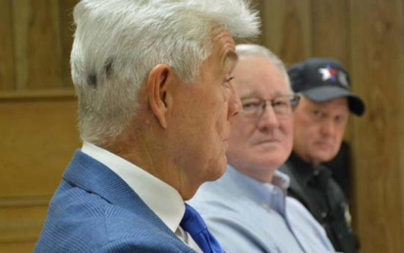 U.S. Rep. Roger Williams, at left, speaks about agricultural issues Friday at the Lampasas County Farm Bureau office as Lampasas County Farm Bureau board members Mickey Edwards, center, and Mike Hail listen. MONIQUE BRAND | DISPATCH RECORD