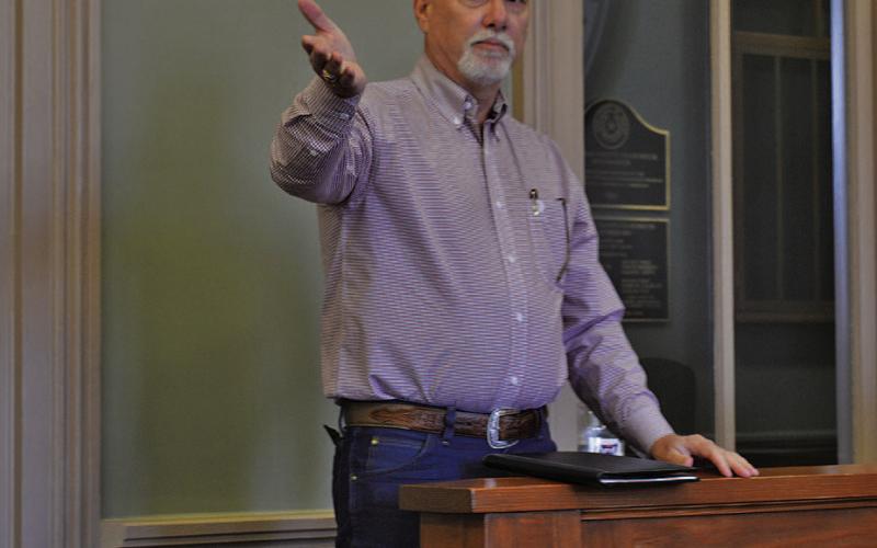 Corix Utilities-Texas President Darrin Barker makes remarks at Monday’s Lampasas County Commissioners Court meeting. He noted upgrades the water system is undergoing and addressed the effect potential new subdivision projects, such as the Pitt Creek Ranch development, might have on Corix customers. ERICK MITCHELL | DISPATCH RECORD