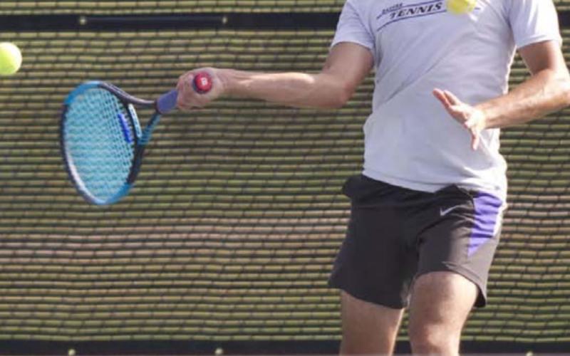 Elias Arrelano sets up for a forehand shot during his mixed doubles match with Kailr Clements on Saturday against Leander. HUNTER KING | DISPATCH RECORD