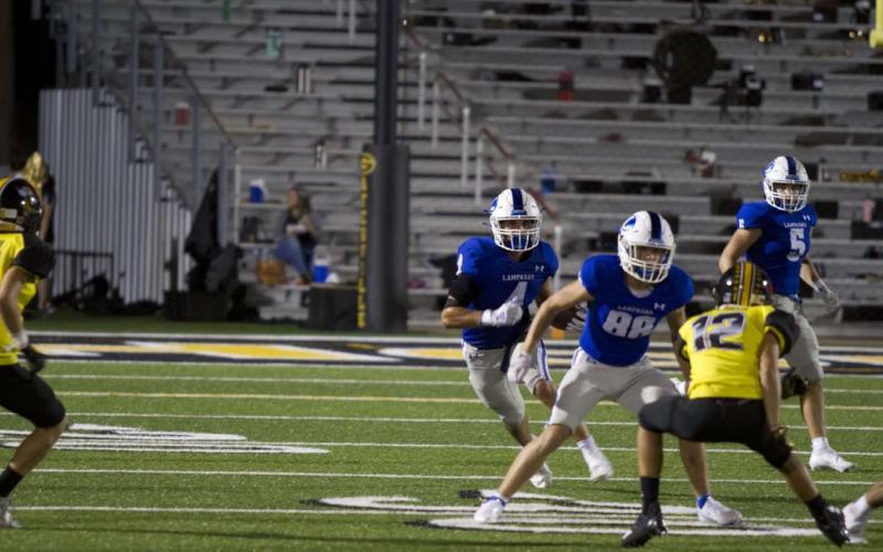 Aden Rascoe follows his blocker on a kick return during the football game against Gatesville on Sept. 24. HUNTER KING | DISPATCH RECORD