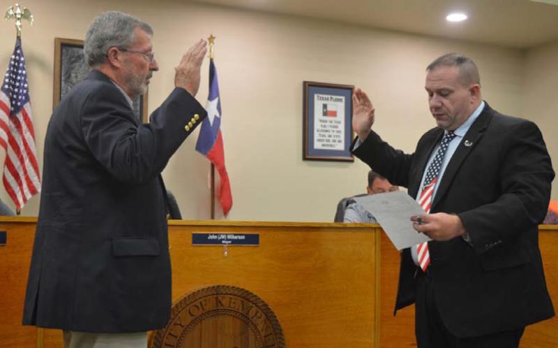 Gene Isenhour, at left, affirms his oath of office for a second term as the city’s municipal judge. Mayor John Wilkerson administered the oath at Tuesday night’s Kempner City Council meeting. ERICK MITCHELL | DISPATCH RECORD
