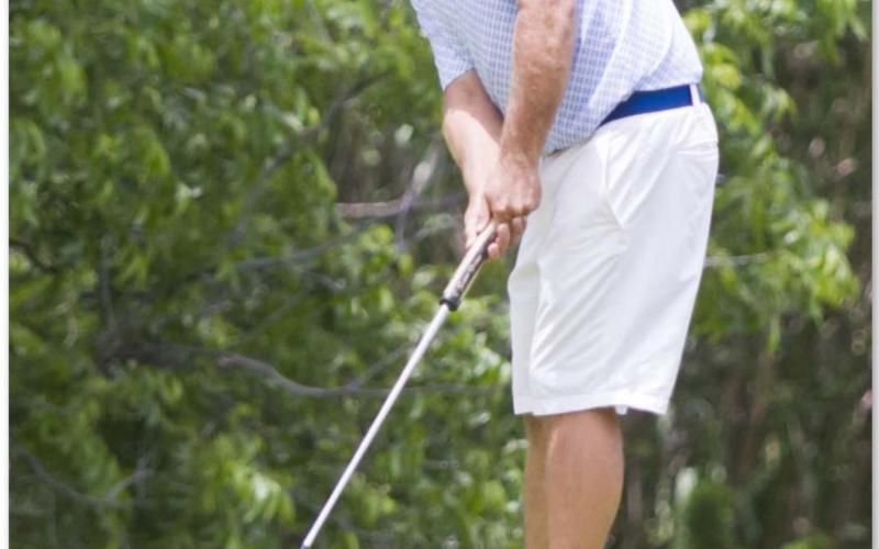 Justin Schulze putts on Hole No. 11 at Hancock Park Golf Course on Saturday afternoon. JEFF LOWE | DISPATCH RECORD
