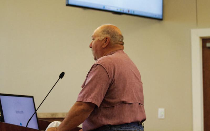 Precinct 4 Commissioner Mark Rainwater speaks at last week’s Lampasas City Council meeting, where he was joined by several dozen other landowners concerned about the impact a proposed rail line project would have on their property. Rainwater and Burnet County Commissioner Damon Beierle are coordinating a public hearing Tuesday at 6 p.m. at Hill Country Fellowship in Burnet. HUNTER KING | DISPATCH RECORD
