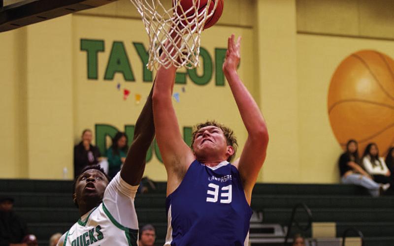 HUNTER KING | DISPATCH RECORD Beau Patterson goes up against a Taylor defender during last Friday’s game.