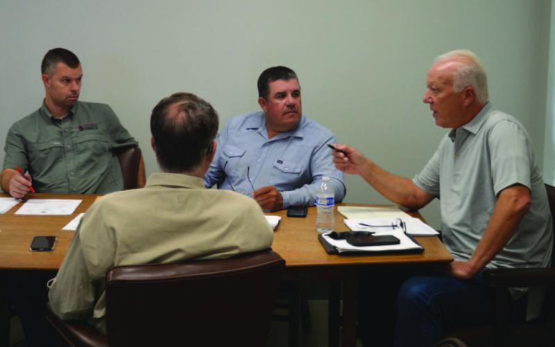 Lampasas Central Appraisal District board members, from left to right, Marshal Brewer, David Barclay, Chris Harrison and Bill Peterson discuss changes to the budget needed for 2025. ERICK MITCHELL | DISPATCH RECORD
