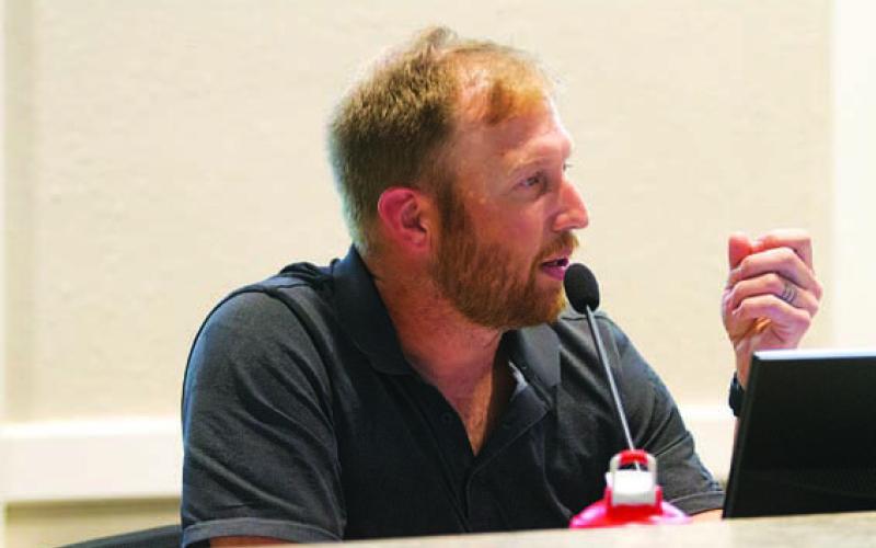 Councilman Edward Gold voices his opposition to a smoke shop planned near the high school campus, but he changed his vote after Interim City Manager Erin Harrison said there were no legal grounds to oppose the special-use permit sought for it. HUNTER KING | DISPATCH RECORD