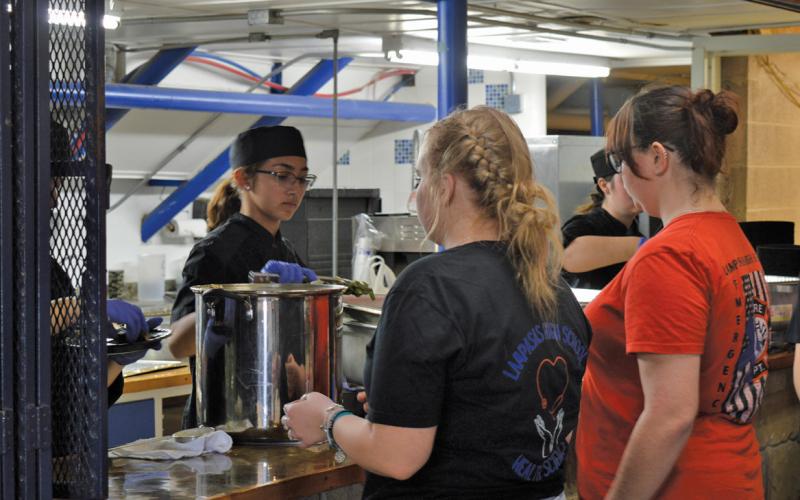 Lampasas High School culinary students were responsible for preparing and delivering dinner at the Creating Badger Builders fundraiser last Saturday. Erick Mitchell | dispatch record