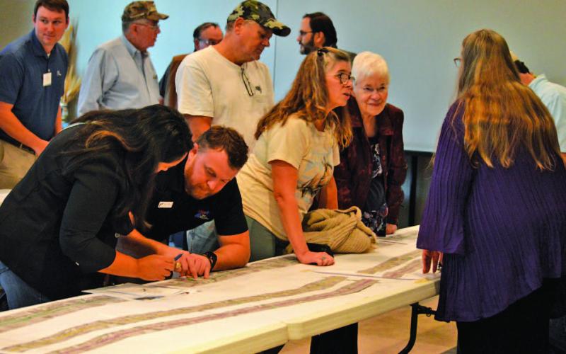 Lampasas County residents chat with TxDOT officials during Tuesday night’s open house to discuss plans for the expansion of U.S. Highway 281 from Lampasas to Evant. ERICK MITCHELL | DISPATCH RECORD