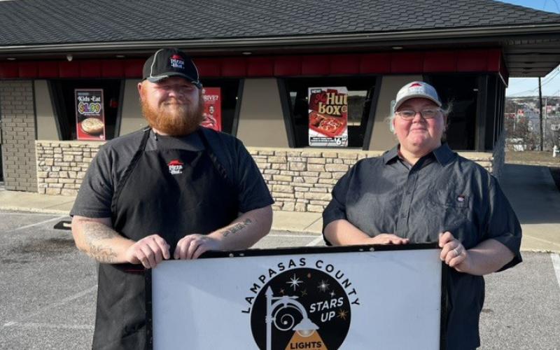Lampasas Pizza Hut associates accepting the Night Sky Friendly award are Joseph White and manager April Ayers. COURTESY PHOTO