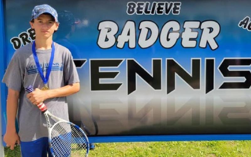 Tyler Ecker is shown with his gold medal from the eighth-grade boys’ singles championship. COURTESY PHOTO